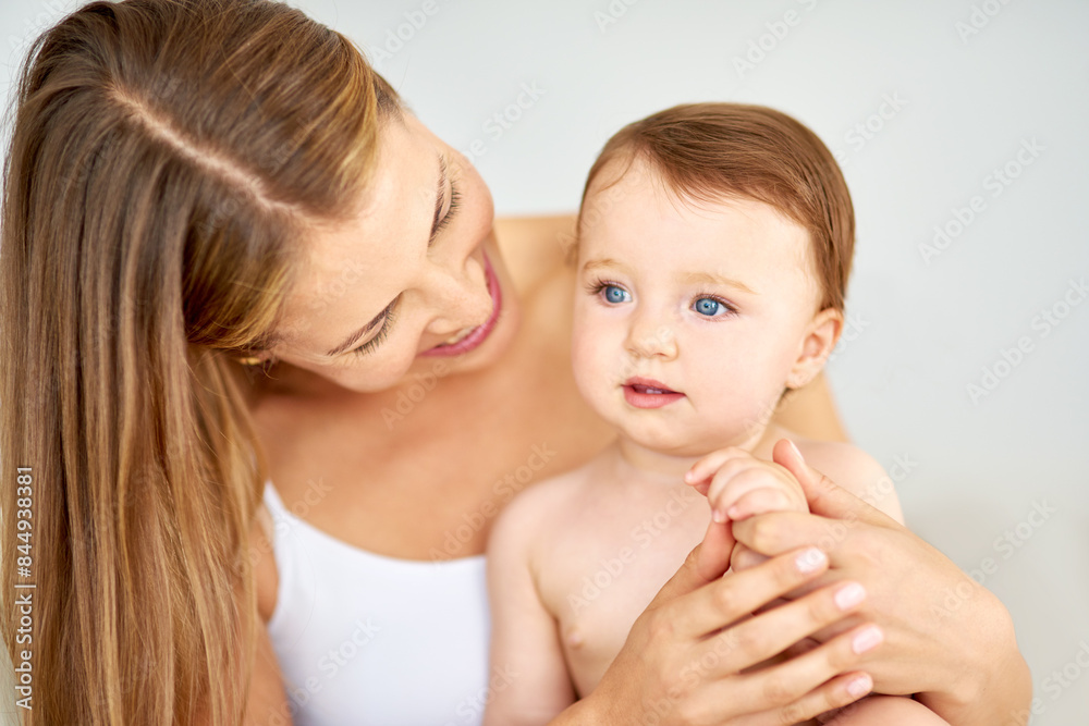 Relax, happy and mother holding baby in diaper at home for safety, love and protection. Smile, care and young mom with cute toddler, kid or child for support and bonding together at family house. Relax, happy and mother holding baby in diaper at home for safety, love and protection. Smile, care and young mom with cute toddler, kid or child for support and bonding together at family house.