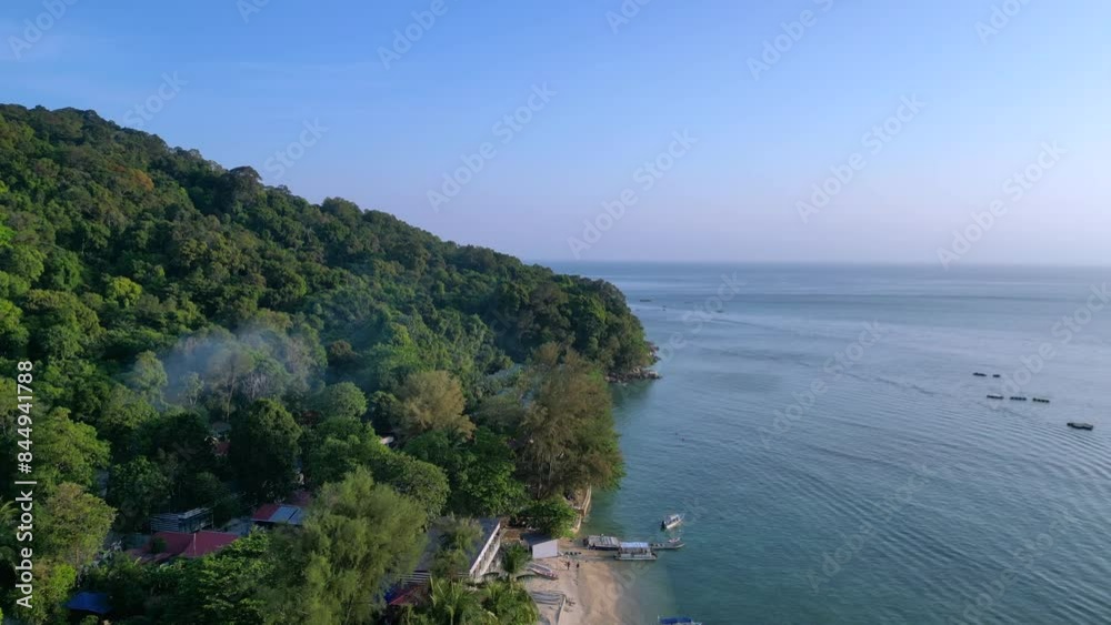 Tropical resort palm trees boats beach in morning. Smooth aerial view drone Tropical resort palm trees boats beach in morning. Smooth aerial view drone