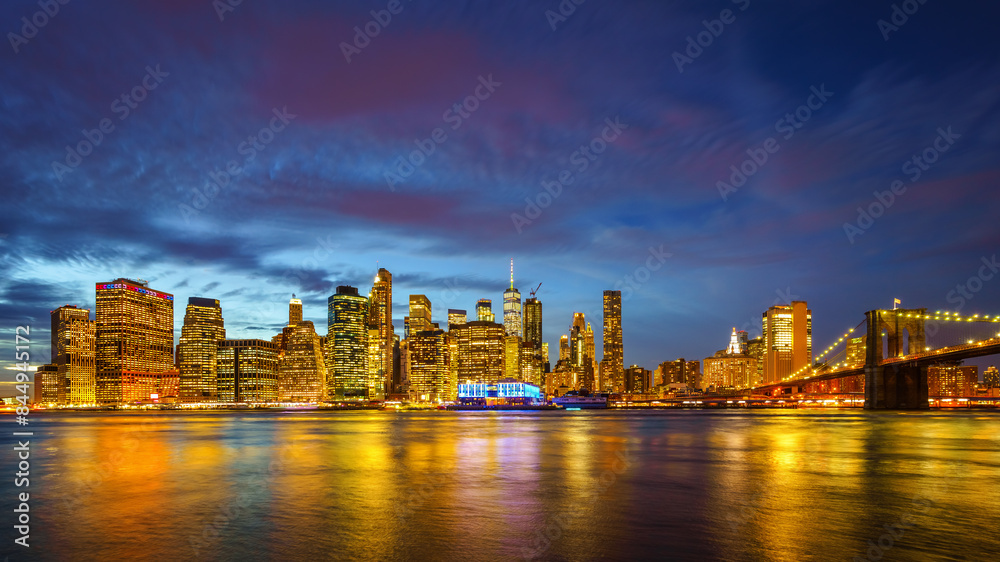 Panoramic view on Manhattan and Brooklyn bridge at dusk, New York City Panoramic view on Manhattan and Brooklyn bridge at dusk, New York City