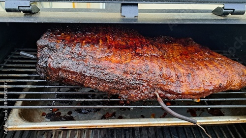 Beef brisket smoked on a charcoal or pellet smoker fat cap up