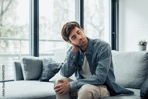 Принти на полотні Upset tired young man feeling pain massaging stiff neck rubbing tensed muscles to relieve back ache joint shoulder discomfort after long sedentary work in incorrect posture, fibromyalgia concept