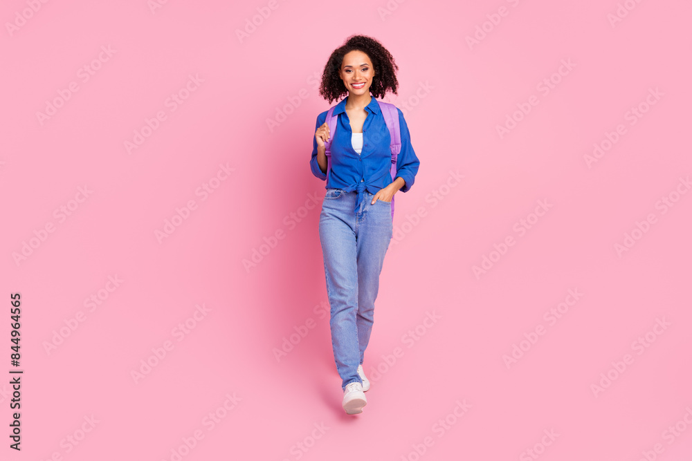 Photo of adorable cheerful girl wear trendy blue clothes go university empty space isolated on pink color background Photo of adorable cheerful girl wear trendy blue clothes go university empty space isolated on pink color background