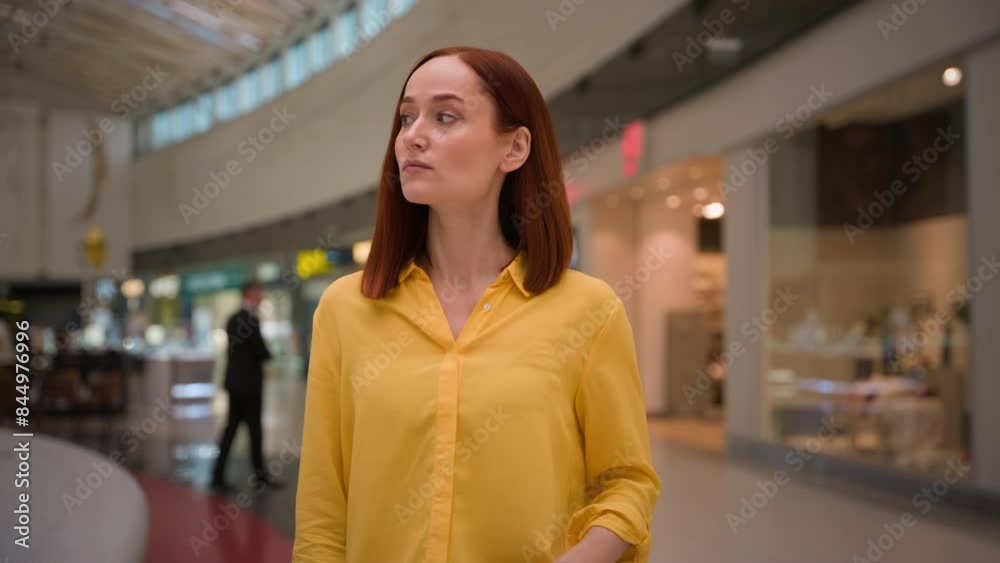 Annoyed dissatisfied serious Caucasian redhead woman girl businesswoman female customer shopper client looking around buyer unhappy expensive prices finding exit lost indoors large shopping mall store Annoyed dissatisfied serious Caucasian redhead woman girl businesswoman female customer shopper client looking around buyer unhappy expensive prices finding exit lost indoors large shopping mall store