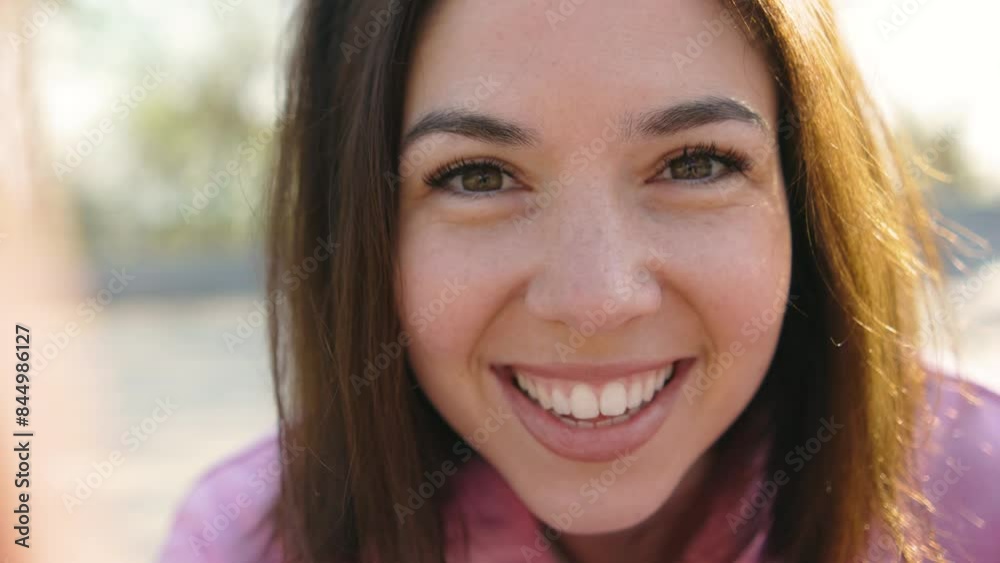 Happy brunette woman blogger sets up video camera for making video blog on sunset outdoors pov Happy brunette woman blogger sets up video camera for making video blog on sunset outdoors pov