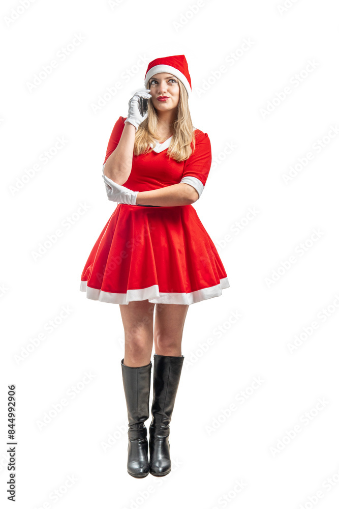 Mother Christmas standing talking on the cell phone Mother Christmas standing talking on the cell phone