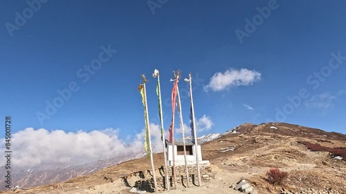 mountain panorama with buddhist prayer flags on a mountain. Blue sky cloud valley. Lauribina, Himalayas of Nepal. Langtang Trek and Gosaikunda Trek photo