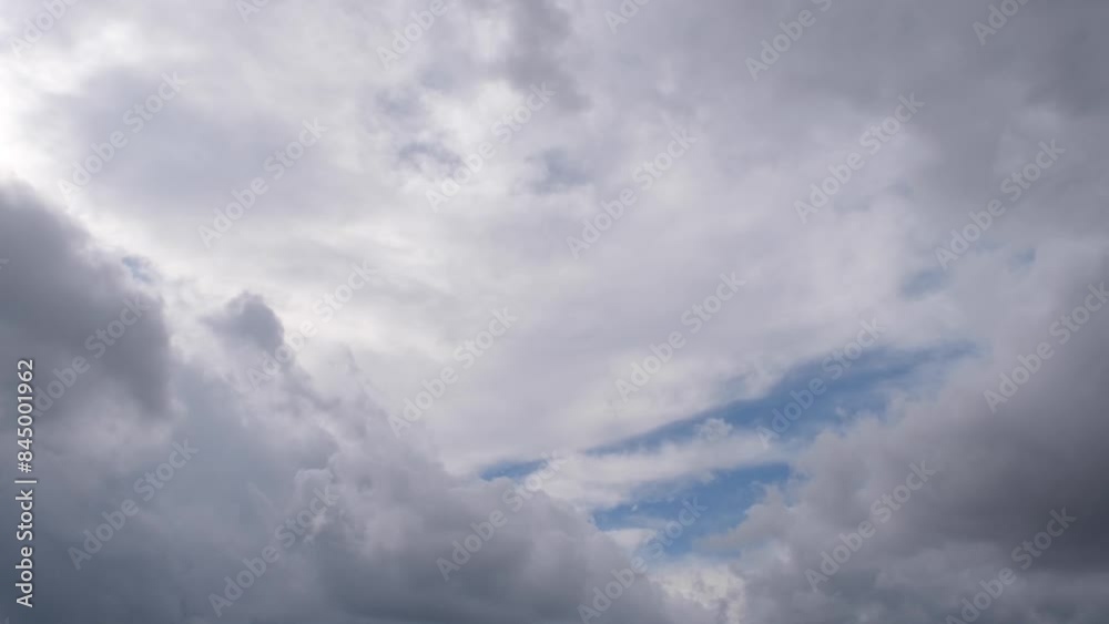 Blue sky visible through approaching storm clouds Blue sky visible through approaching storm clouds