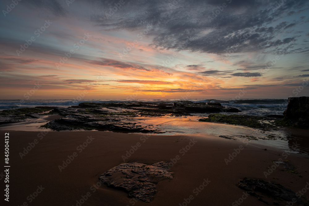 Obraz premium Sunrise at the beach on a summers morning