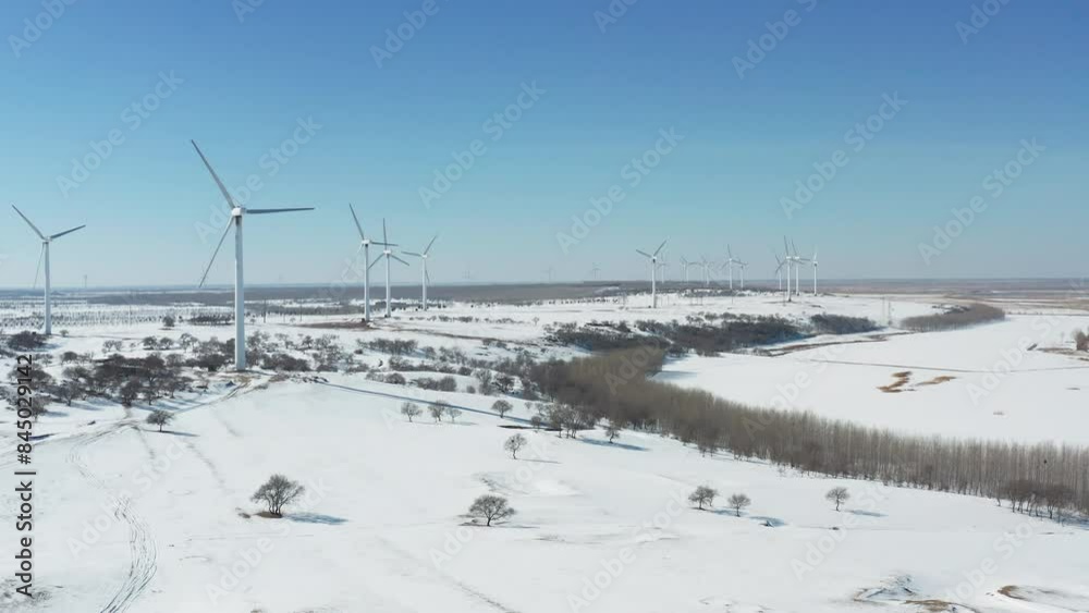 Aerial photography of wind power generation in the winter snow in Duerbert County, Daqing City Aerial photography of wind power generation in the winter snow in Duerbert County, Daqing City