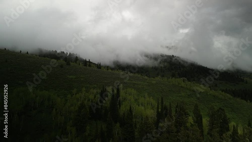Aerial of stormy low clouds in Cache National Forest in Logan Canyon Utah in spring photo