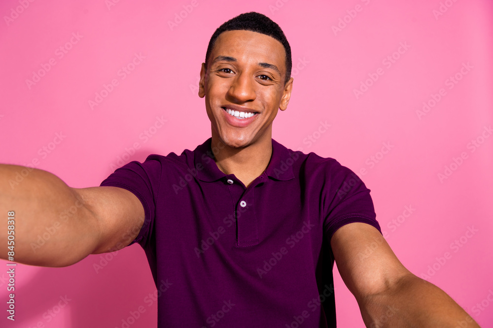Photo portrait of nice young male selfie photo smile dressed stylish violet garment isolated on pink color background Photo portrait of nice young male selfie photo smile dressed stylish violet garment isolated on pink color background