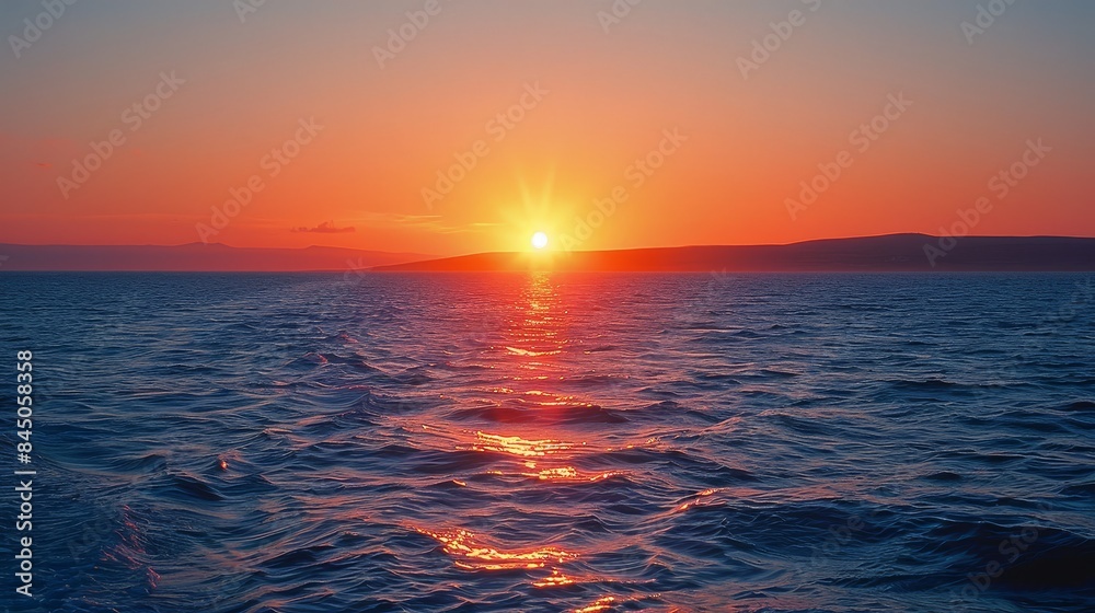 Sunset Over the Ocean with a Glowing Horizon - A beautiful sunset over the ocean, with a glowing horizon and red and orange tones. Sunset Over the Ocean with a Glowing Horizon - A beautiful sunset over the ocean, with a glowing horizon and red and orange tones.