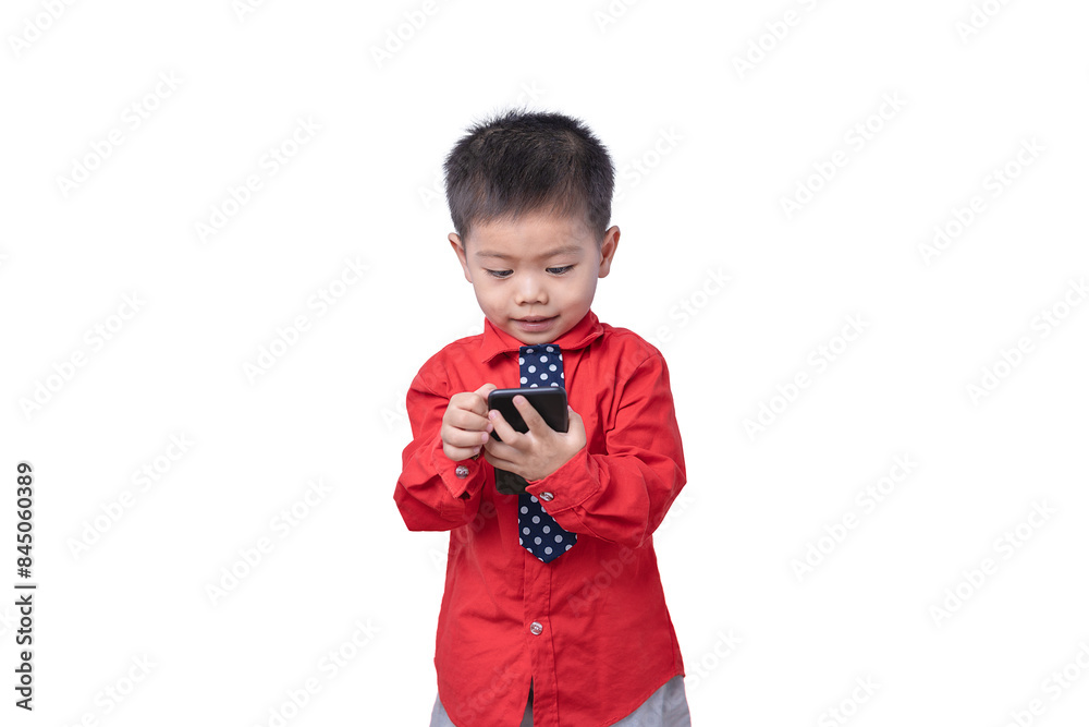 Little small smiling happy boy 3-4 years old wearing a red shirt and holding in hand play smartphone isolated on white background studio portrait. Children and gaming addiction and lifestyle concept Little small smiling happy boy 3-4 years old wearing a red shirt and holding in hand play smartphone isolated on white background studio portrait. Children and gaming addiction and lifestyle concept