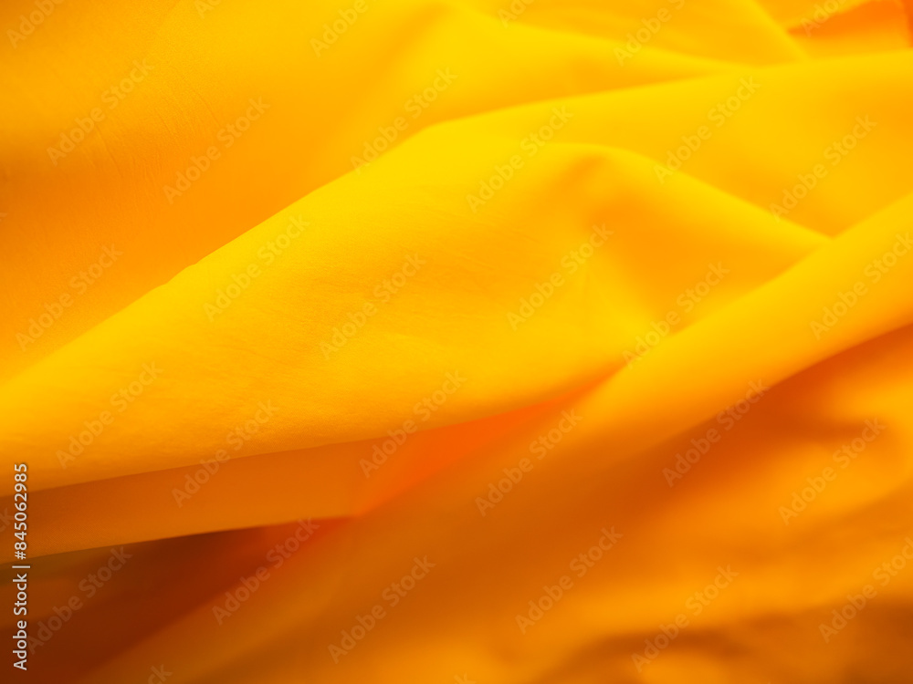 Obraz premium Yellow Background Cloth Fabric Orange Color Gradient Texture Pattern Silk Wave Banner Gold, Fashion Material Backdrop Poster for Summer Tropical Travel Holidays, Satin Mockup Luxury Premium.