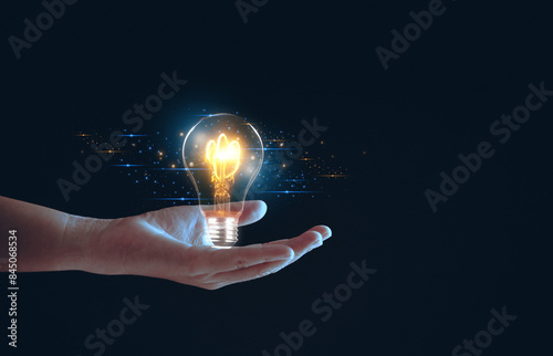 Solution or creative idea for designing a web banner or landing page for an innovative company with a hand sticking out of the screen with a light bulb. Famous abstract geometric shapes and lead lines