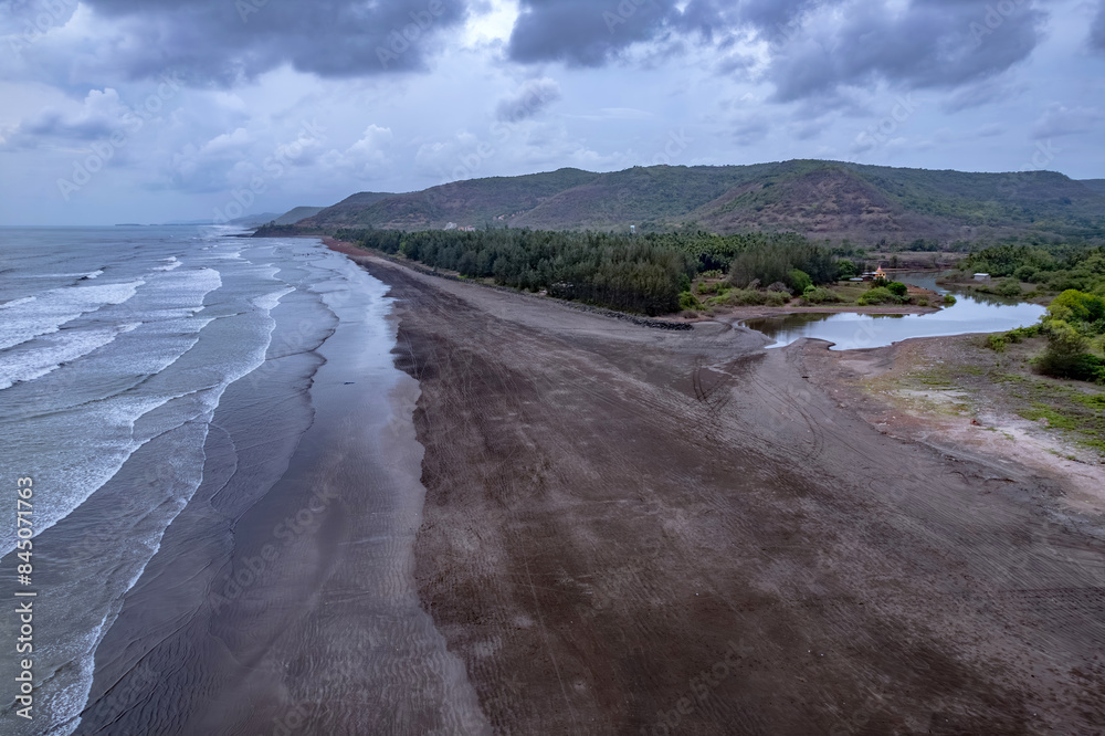 Fototapeta premium Aerial footage of Harnai beach at Dapoli, located 200 kms from Pune on the West Coast of Maharashtra India.