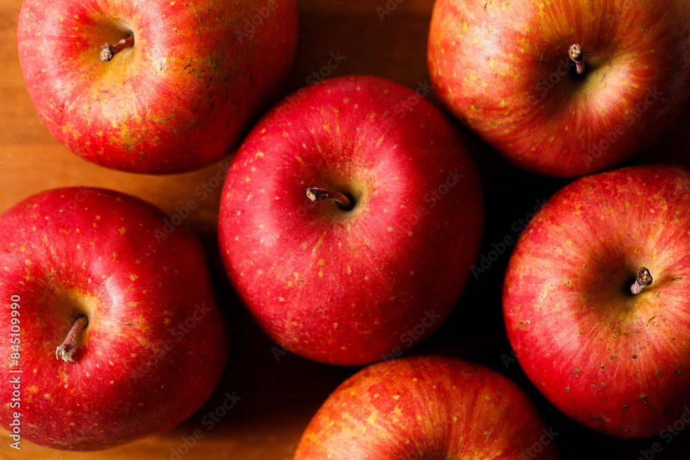 Ripe organic red apple on wooden table background. Ripe organic red apple on wooden table background.