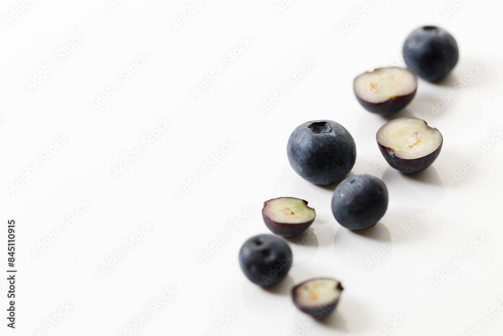 Ripe organic blueberries on white wooden table background. Selective focus. Ripe organic blueberries on white wooden table background. Selective focus.