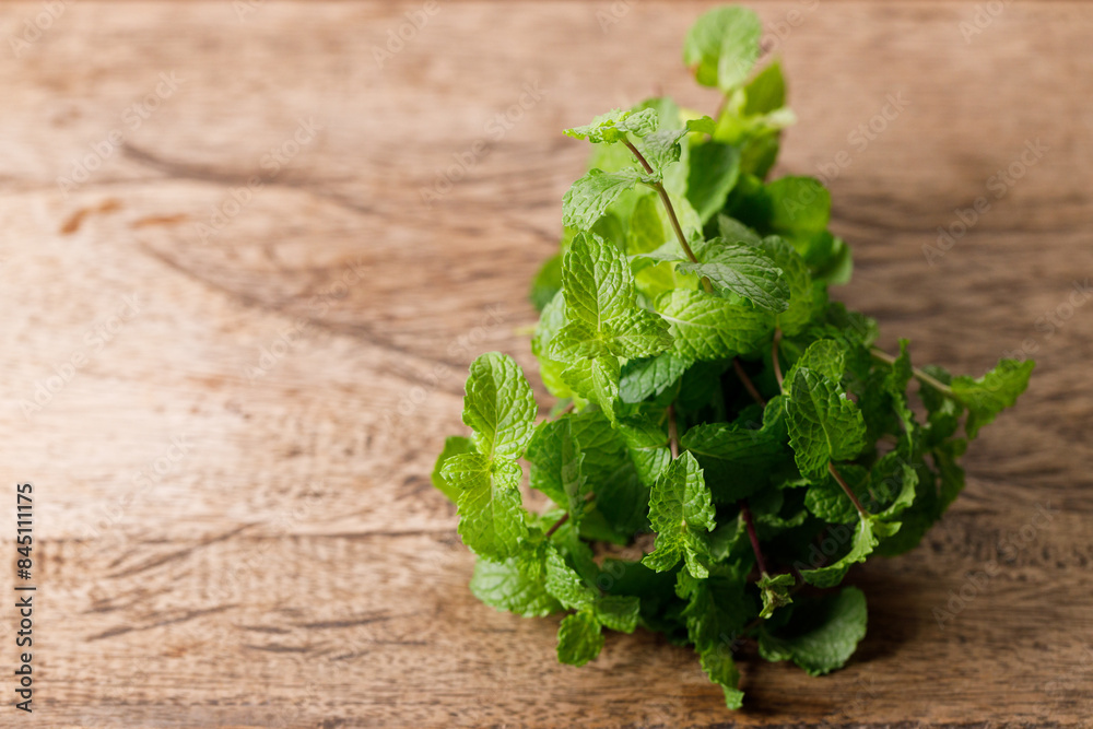 Fresh organic mint on rustic wooden background. Selective focus. Fresh organic mint on rustic wooden background. Selective focus.