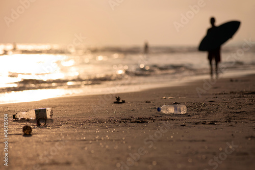 Photography Waste plastic bottles that will be brought to the beach by waves, silhouette of