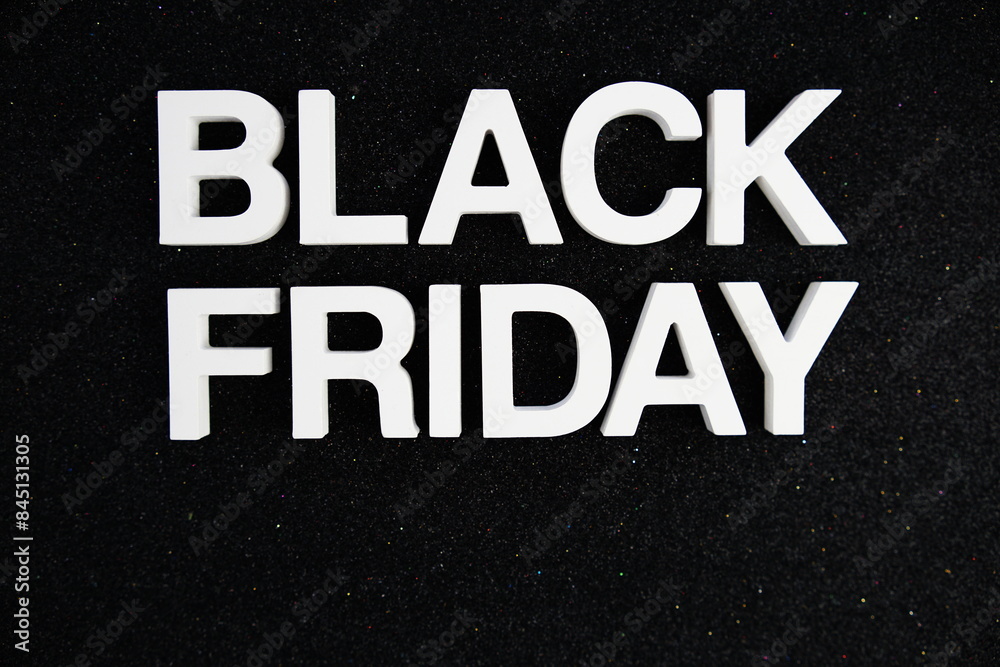 Black Friday alphabet letters on black glitter background Black Friday alphabet letters on black glitter background