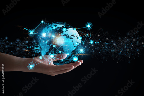 Hand holding a blue globe with several dots on it, network connection technology concept, communication spanning the world, abstract icon concept with blue glow pattern lines on the hand.