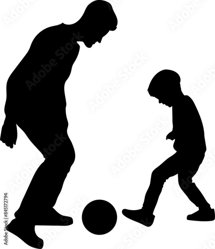 Dad and son playing soccer silhouette