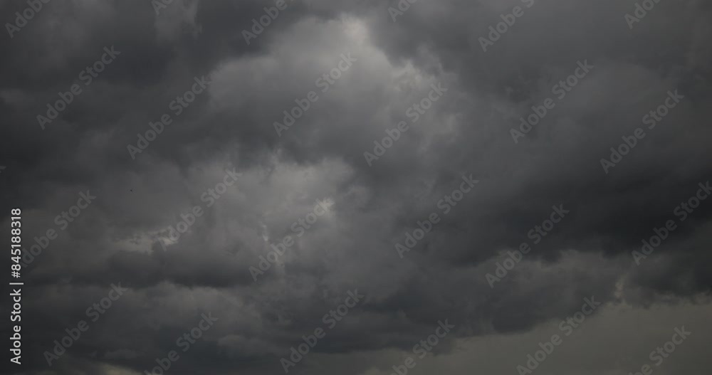 Dark clouds fly across the sky. A cyclone is approaching with rain, wind and storm. Dark clouds fly across the sky. A cyclone is approaching with rain, wind and storm.