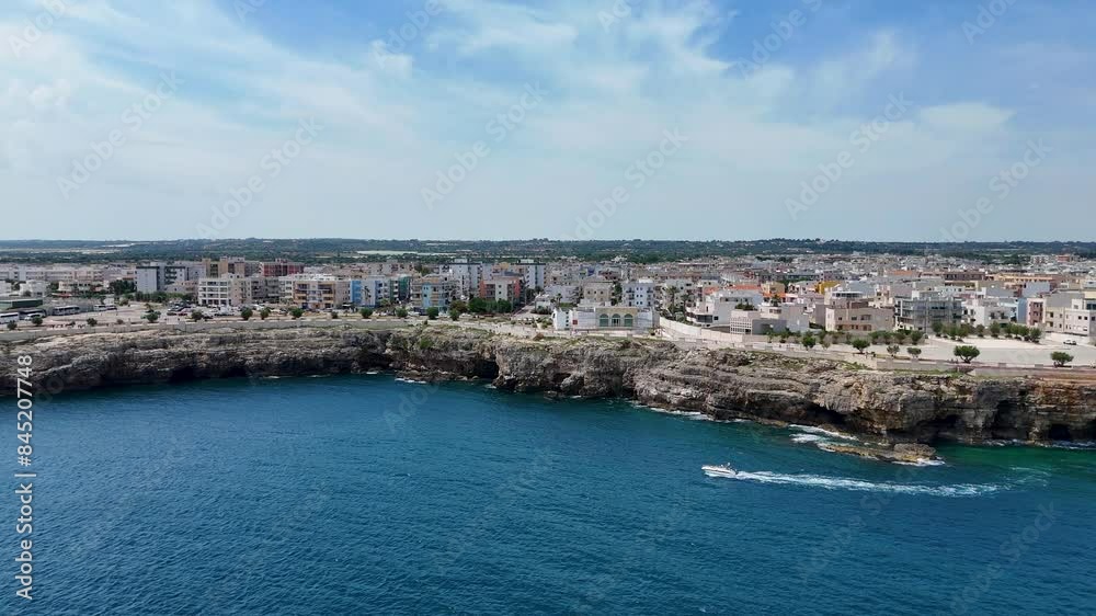 Soaring Above Puglia's Rocky Shoreline with Polignano A Mare in the Background, Italy Soaring Above Puglia's Rocky Shoreline with Polignano A Mare in the Background, Italy