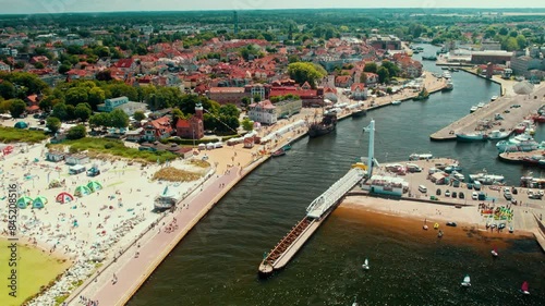 Port in a small twon by the sea with a foot bridge photo