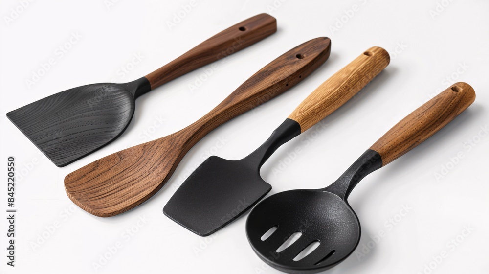 Set of cooking tools with spatulas on a blank white surface. Set of cooking tools with spatulas on a blank white surface.