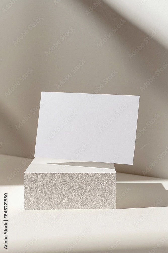 Business card floating on a white paper background, elegant and minimalistic design Business card floating on a white paper background, elegant and minimalistic design
