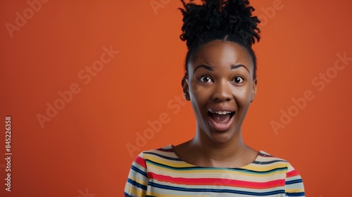 Amazed black woman with raised eyebrows open mouth, stunned person girl culture © antkevyv
