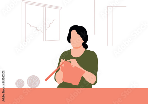 The girl is embroidering with yarn.