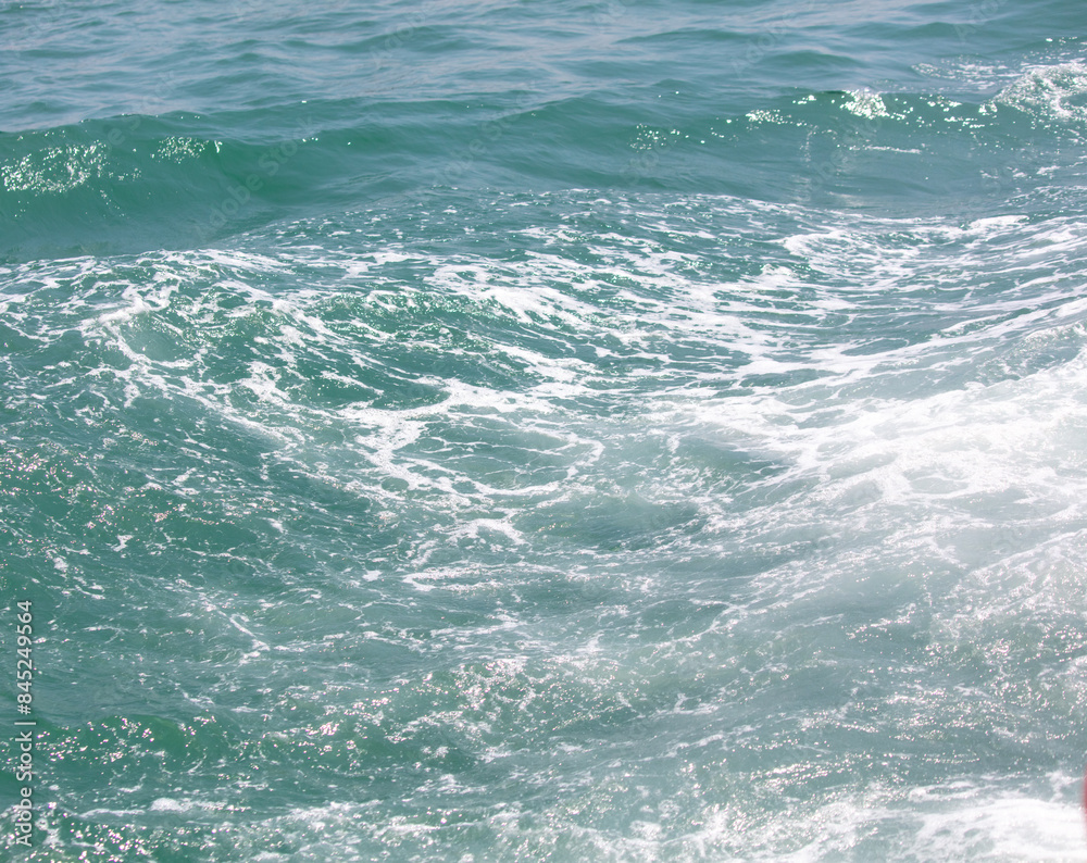 Fototapeta premium Waves in the sea abstract background. Texture