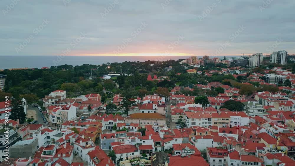 Aerial cityscape basking sunset glow with orange sky. Twilight on urban skyline Aerial cityscape basking sunset glow with orange sky. Twilight on urban skyline