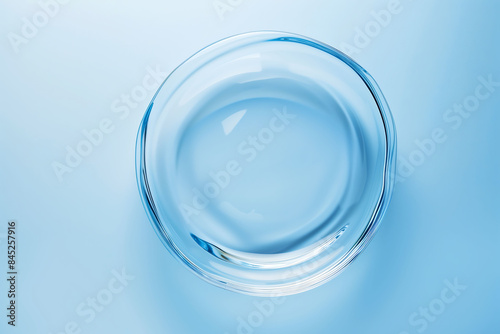Circle shape in glass effect on blue color background for product presentation.