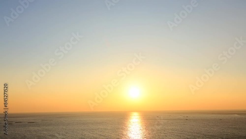 Seascape with the sun rising. intense sunlight - time lapse