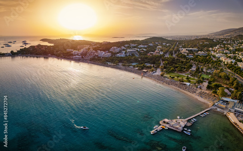 Aerial sunset view of the popular beach and bay of Vouliagmeni, south Athens suburb, Greece