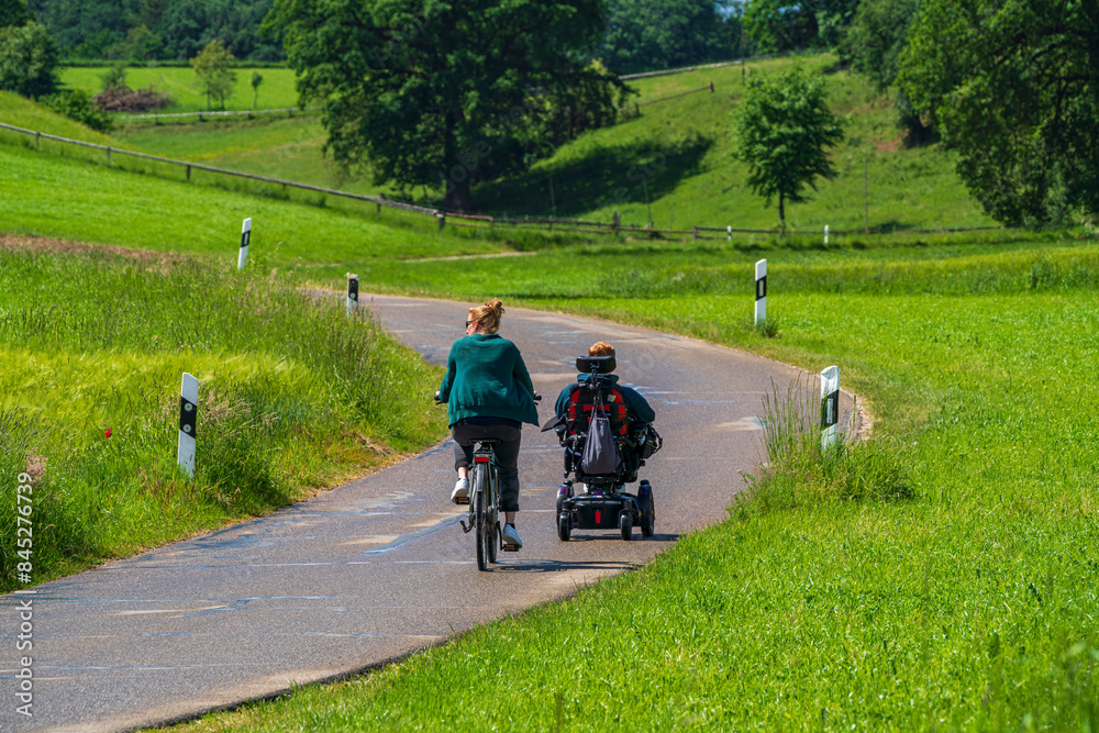 Fototapeta premium Family with different life generations on the road and enough their time at green landscape