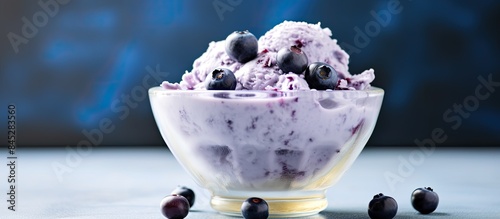 Create a gluten free and dairy free healthy dessert by blending frozen bananas with blueberries to make a nice cream This treat is perfect for anyone looking for a refreshing and guilt free dessert o photo