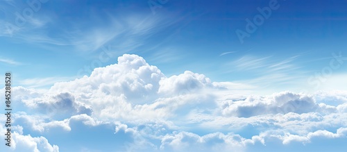 The sky is adorned with crisp white clouds creating a serene and picturesque backdrop A high resolution file is available with ample advertising copy space below