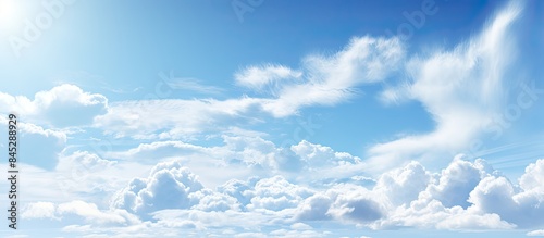 A cute blue and white sky serves as a charming wallpaper background offering a refreshing and soothing view A copy space image that brings a sense of tranquility and beauty to any device or display