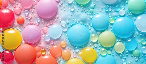 A colorful gel foam background with a beautiful bright surface filled with colored bubbles resembling a soft rubber stress ball or plasticine It exudes relaxation and strength like sweet dessert Idea