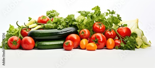 Copy space image featuring fresh tomatoes and cucumbers of vibrant colors showcased on a pristine white background providing a perfect spot for accompanying text