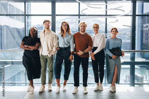 Successful business team standing together in a row photo