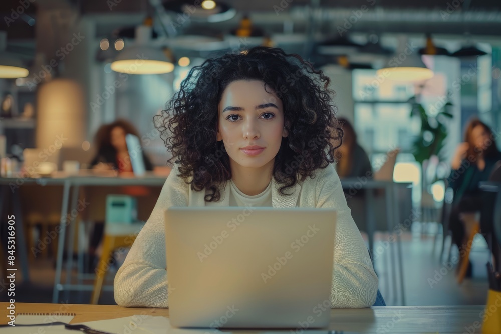 college student using laptop in library