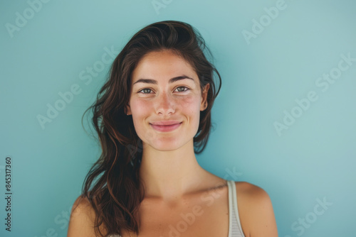 A close up portrait of a woman with a subtle smile