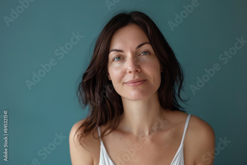 A close up portrait of a woman with a subtle smile
