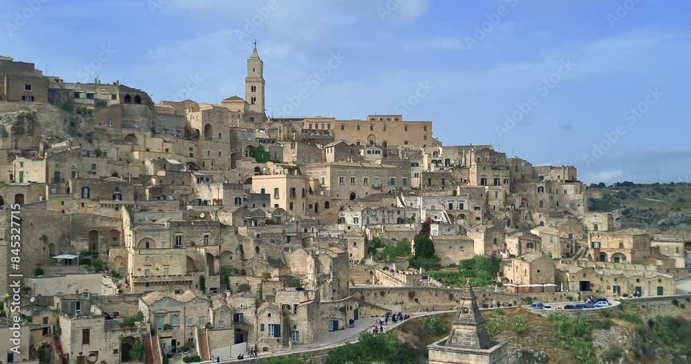 Matera holiday, summer, panorama of historic Matera stone with bell tower under blue sky, European Capital of Culture 2019, concept of cultural holidays and tourism in Italy gastronomy and culture Matera holiday, summer, panorama of historic Matera stone with bell tower under blue sky, European Capital of Culture 2019, concept of cultural holidays and tourism in Italy gastronomy and culture